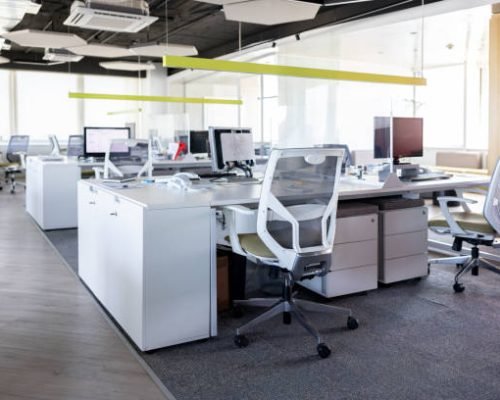 Modern office space with several cubicles and no people -