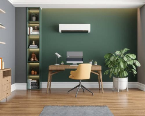 Home Office Interior With Air Conditioner, Table, Desktop Computer And Wooden Cabinet